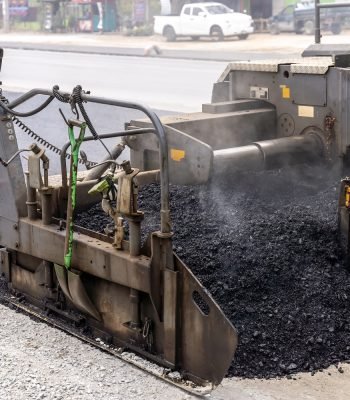 road-paving-machine-laying-fresh-asphalt-on-road-2026-01-09-08-25-46-utc